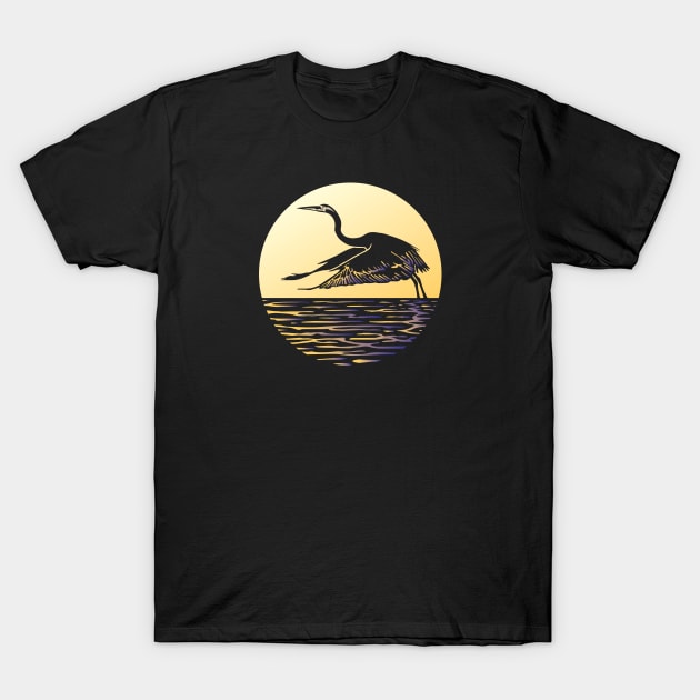 Great Blue Heron Flying in front of Sun T-Shirt by LucentJourneys